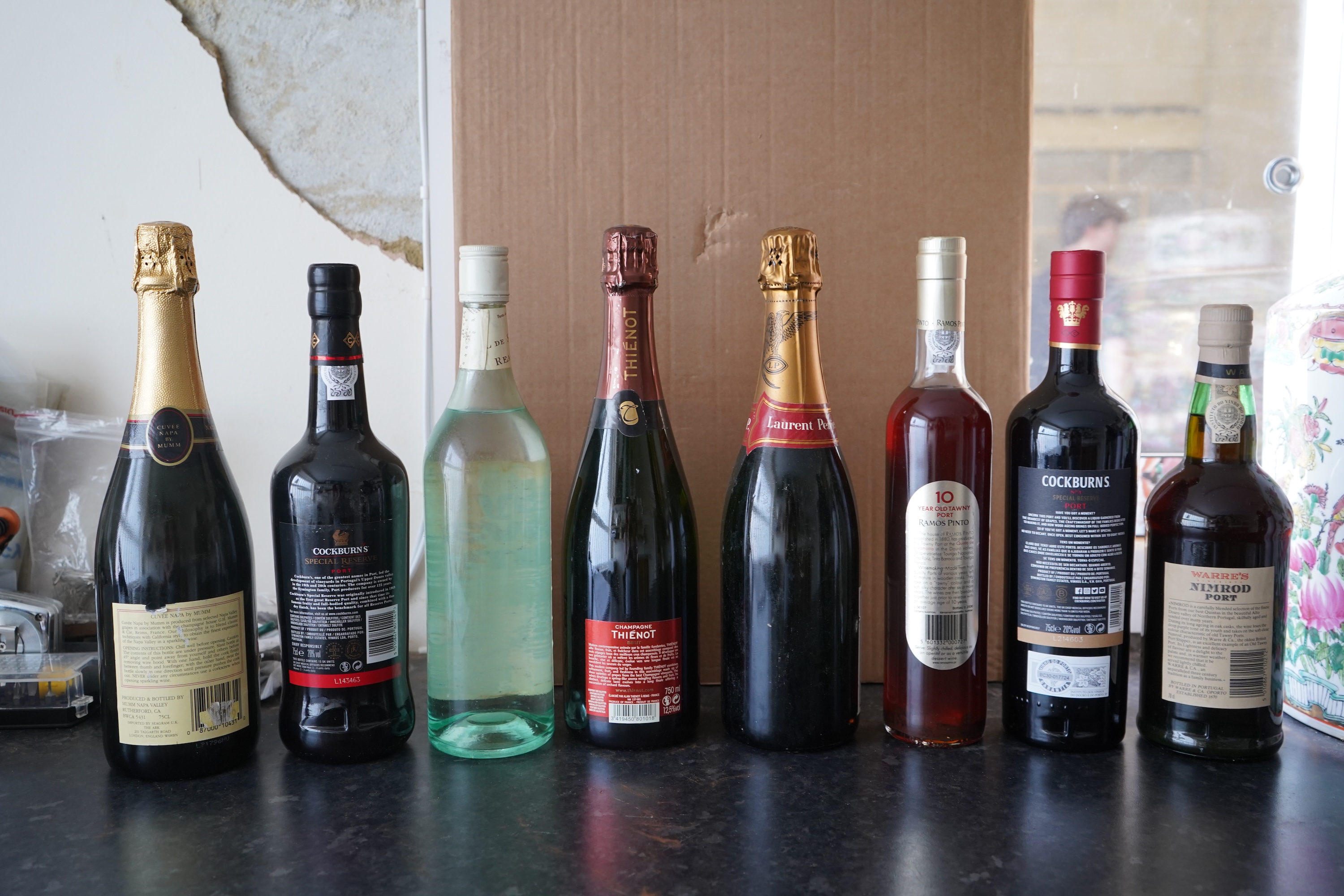 Eight bottles of champagne, port and rum to include Mumm, Laurent Perrier and Warres